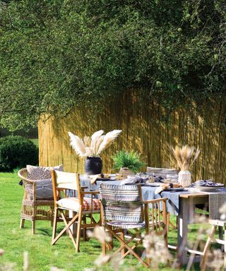 garden table with pampas and ornamental grasses