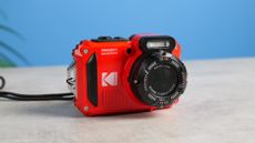 A red Kodak PIXPRO WPZ2 compact camera