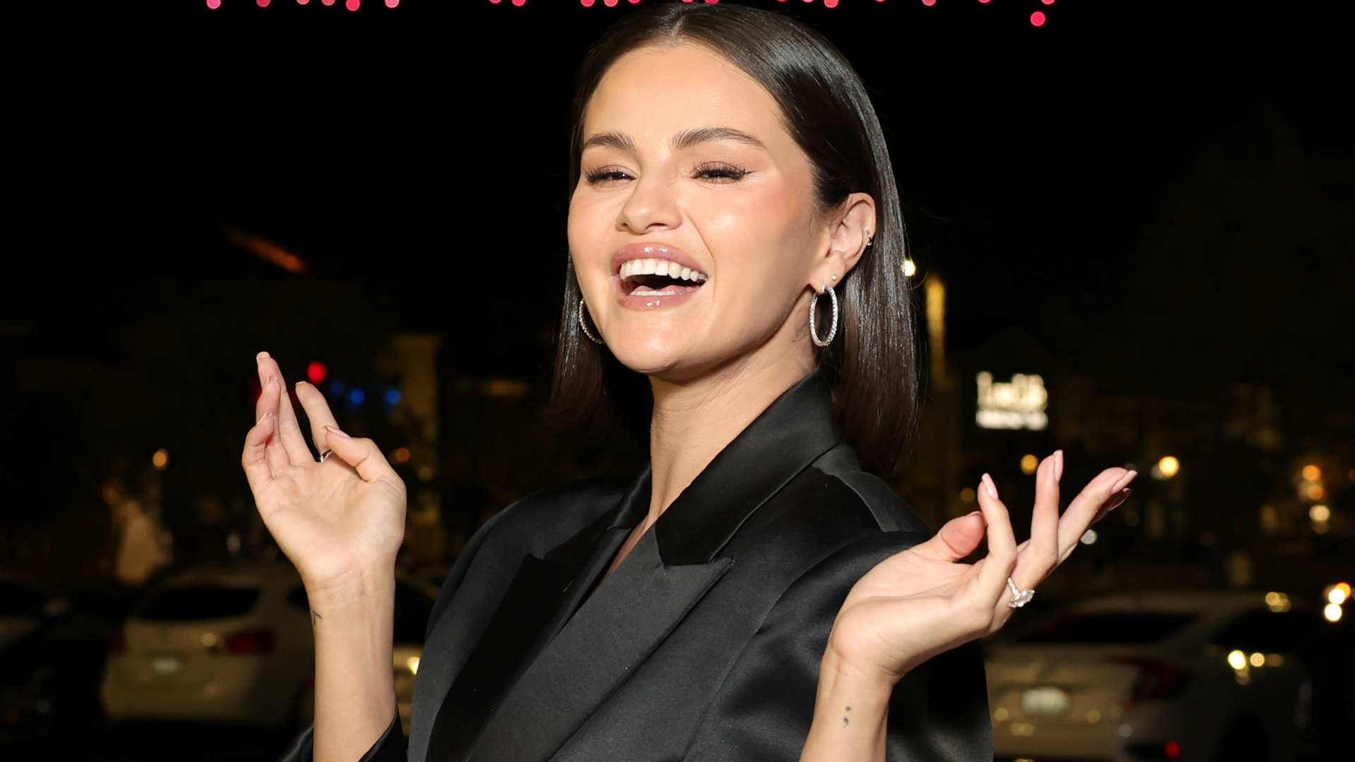 Selena Gomez wore ultra-wide-leg jeans with a cropped black jacket