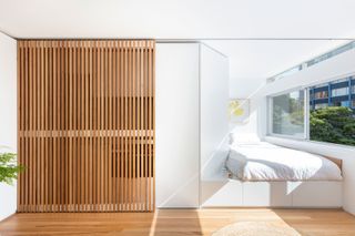 a studio apartment with a sliding screen