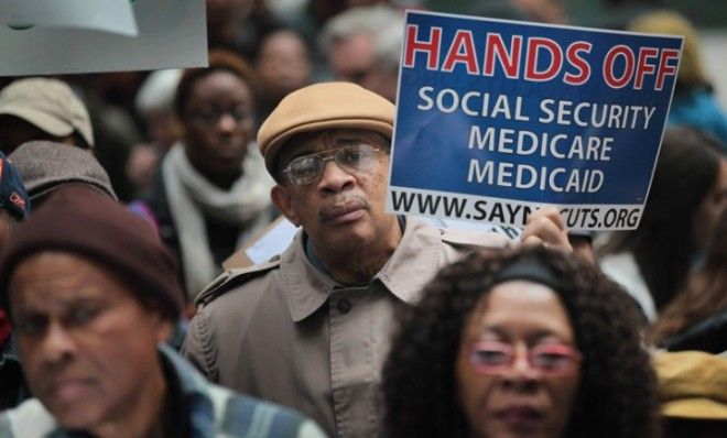 Demonstrators, including many senior citizens, protest against cuts to federal safety net programs.