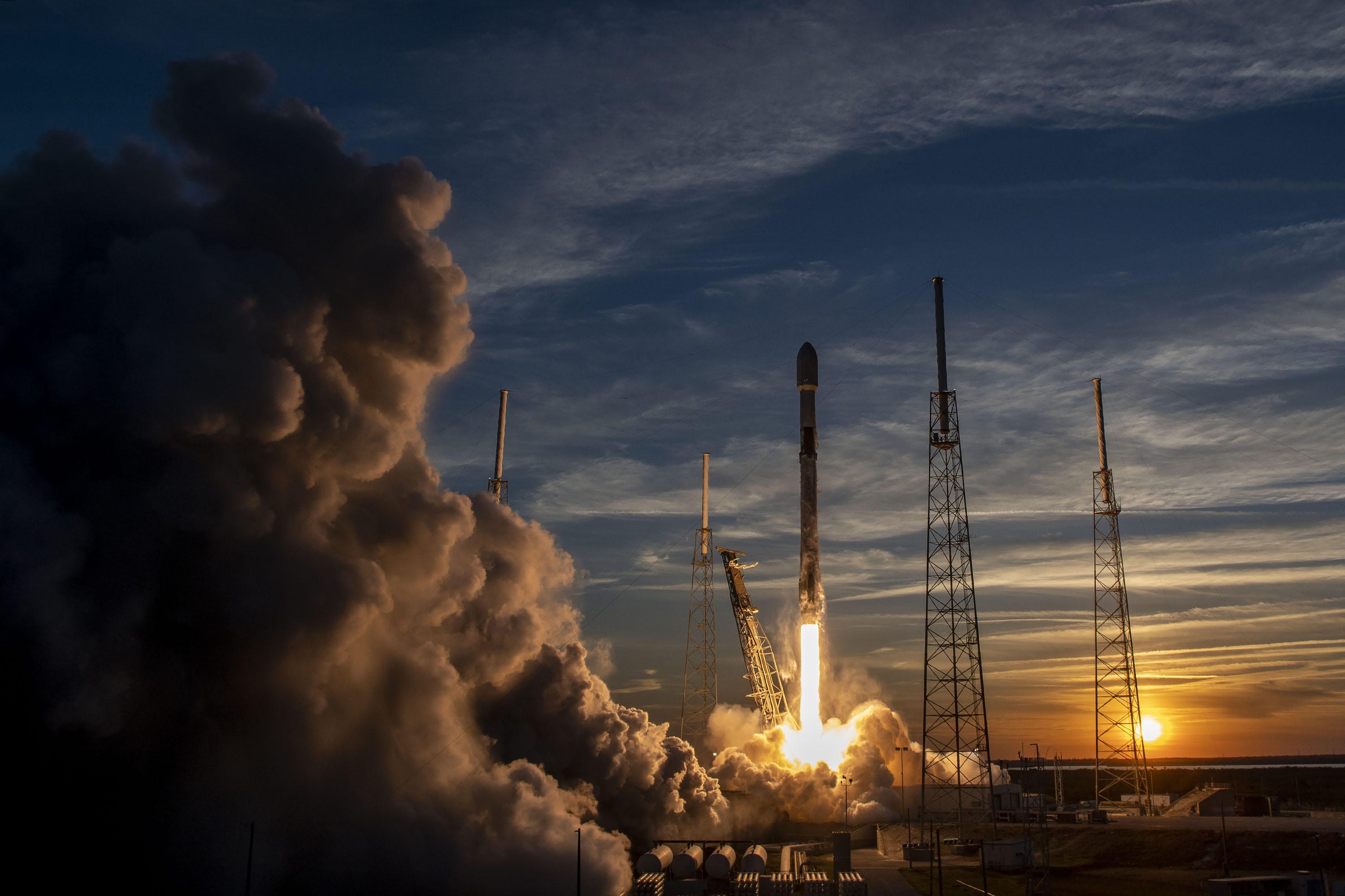 A SpaceX Falcon 9 rocket launches 21 Starlink 