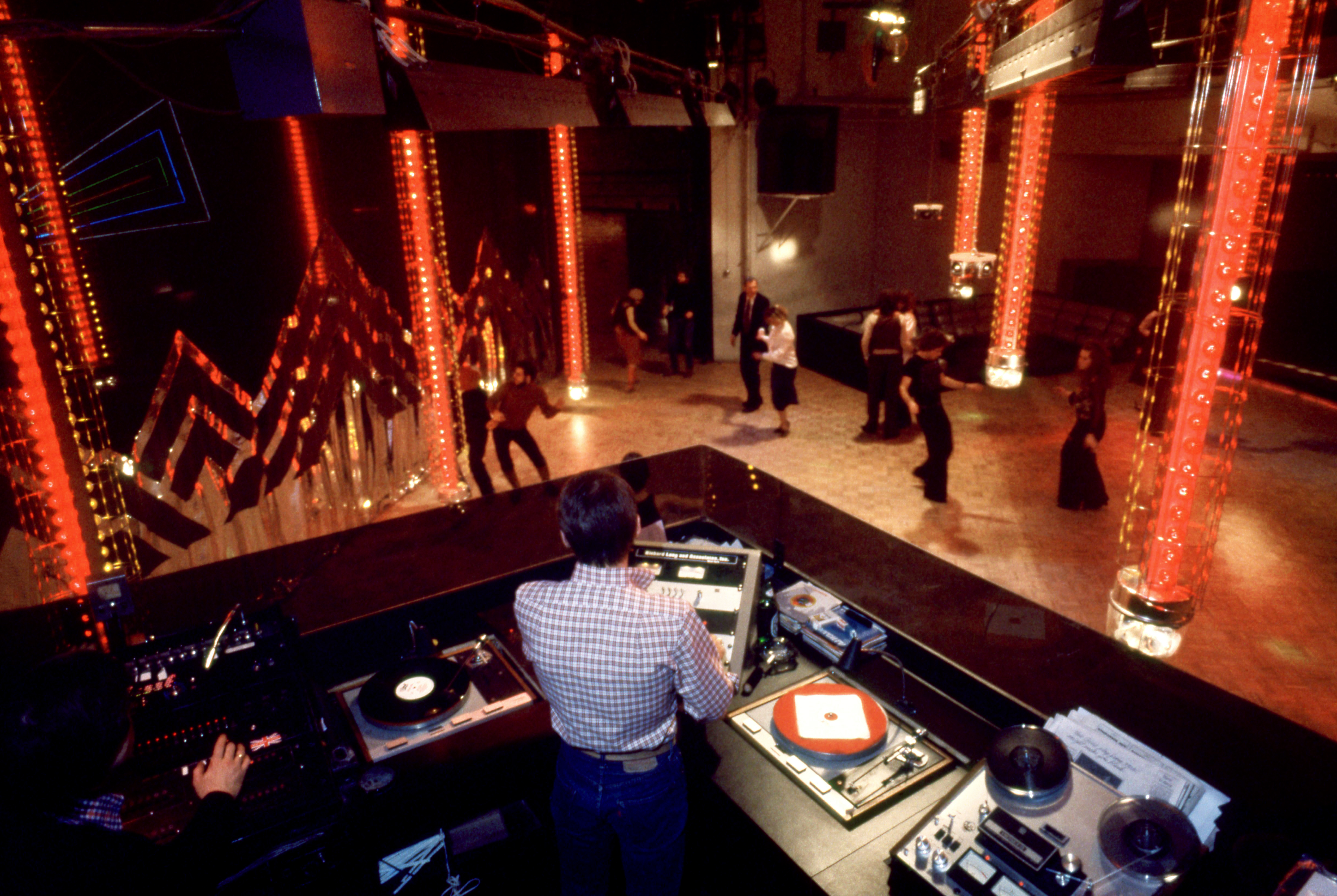 An above angle of the DJ booth as people dance on the floor at the Manhattan nightclub and disco Studio 54 in New York, New York, circa 1979. (Photo by Oscar Abolafia/TPLP/Getty Images)