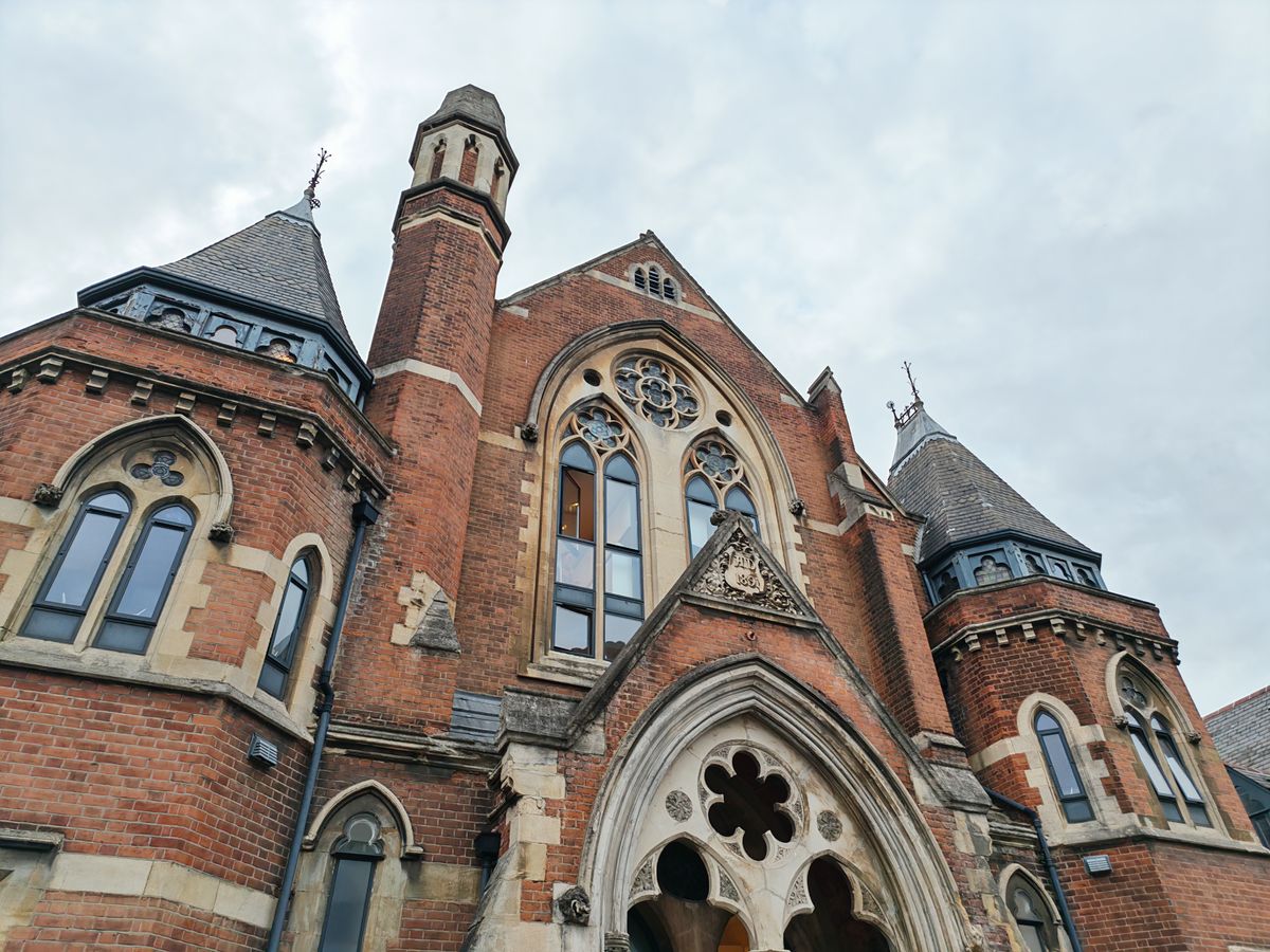 A building with gothic windows and towers