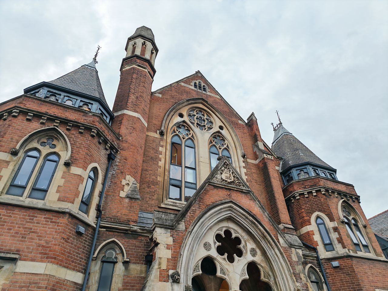 A building with gothic windows and towers