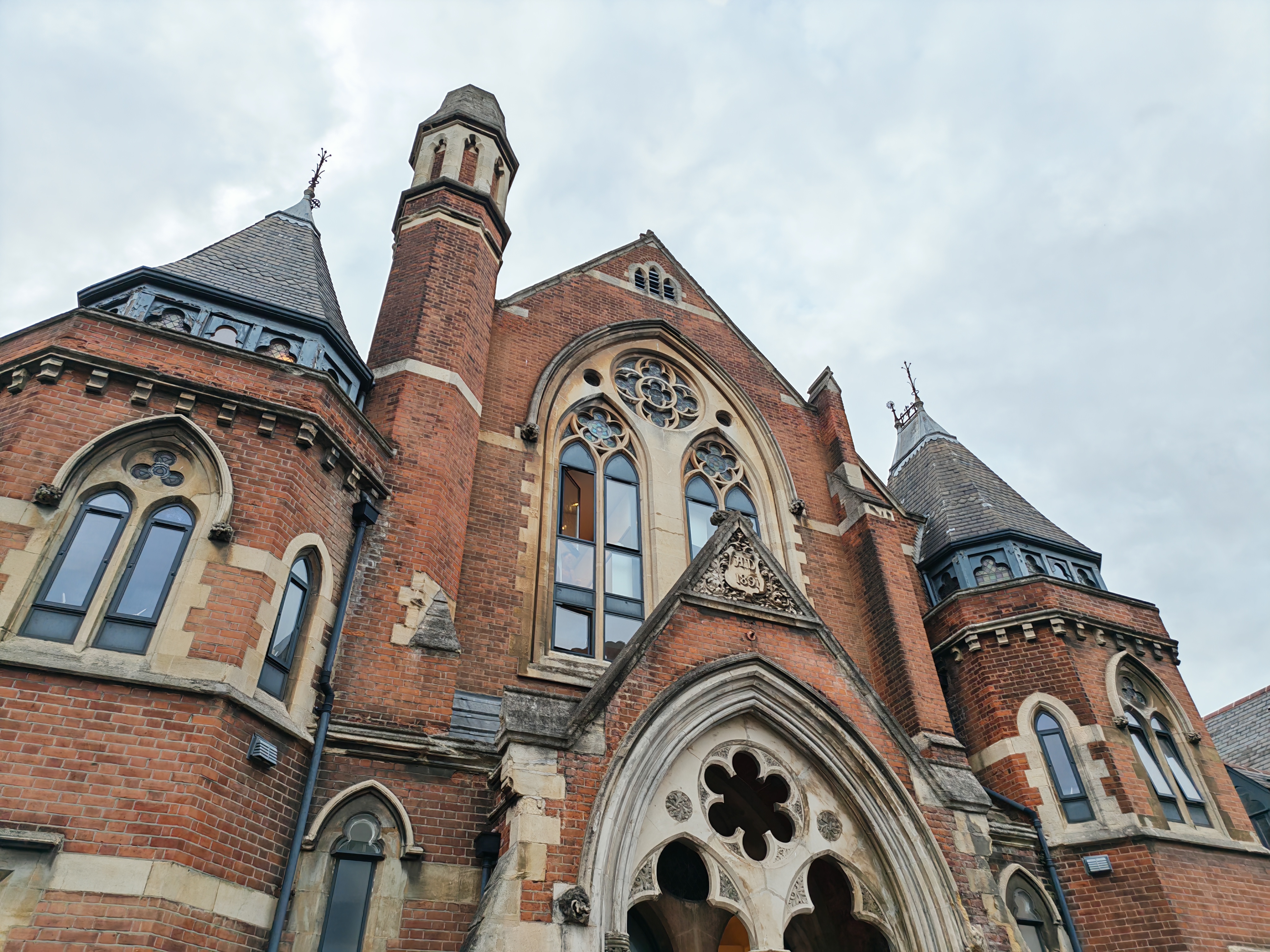 A building with gothic windows and towers