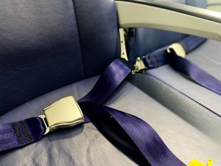A close up on an airplane seatbelt