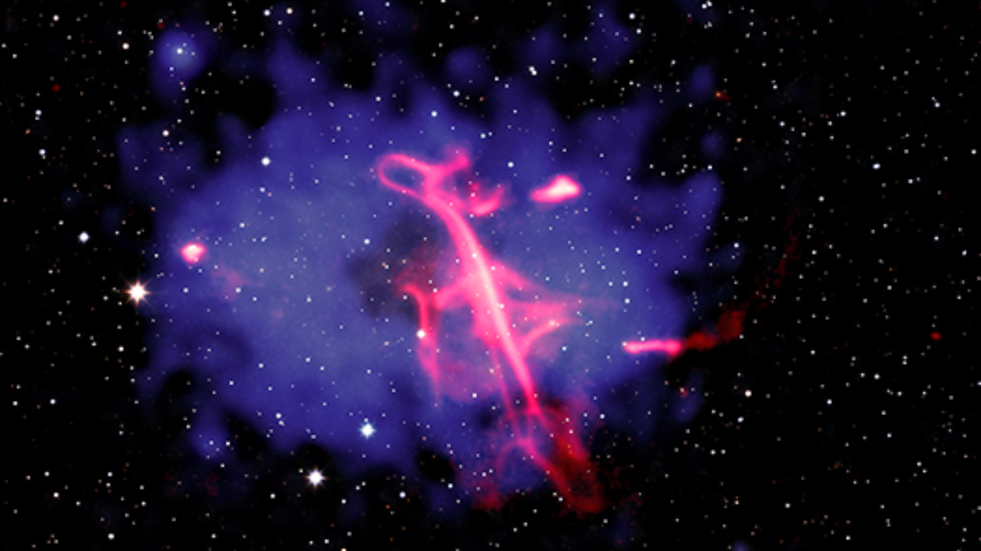 Supermassive black hole blasts out a neon 'treble clef' | Space photo of the day for Oct. 16, 2026