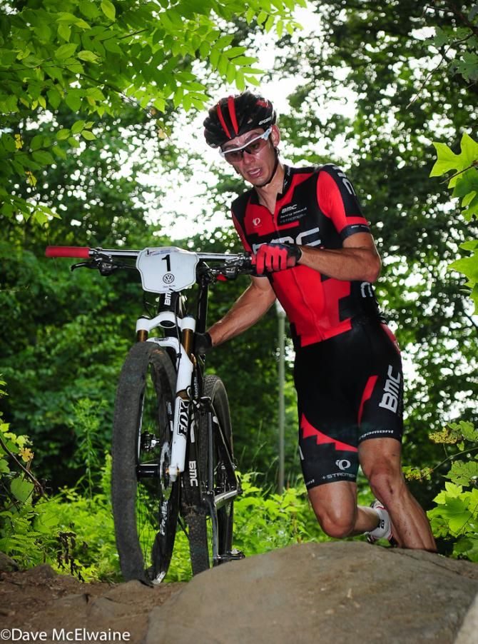 Stephen Ettinger (BMC) running with a flat tire on lap two