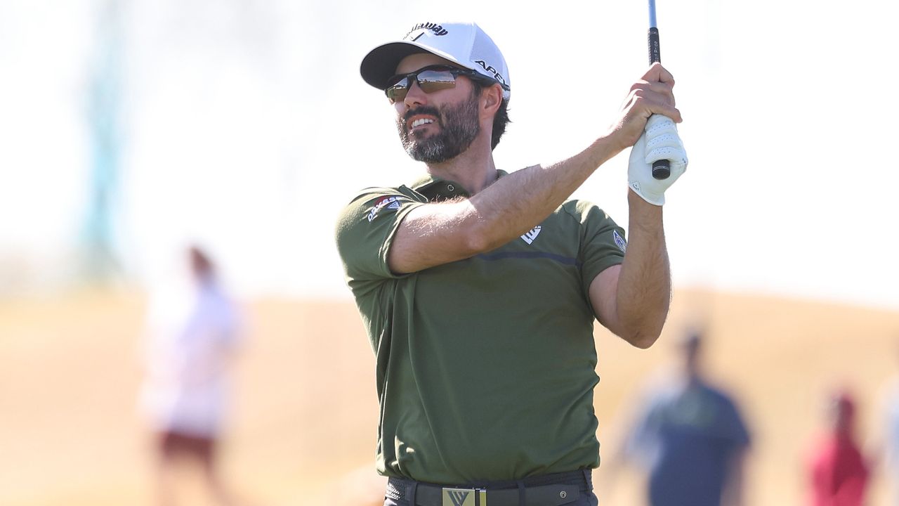 Adam Hadwin hits an iron shot at the WM Phoenix Open