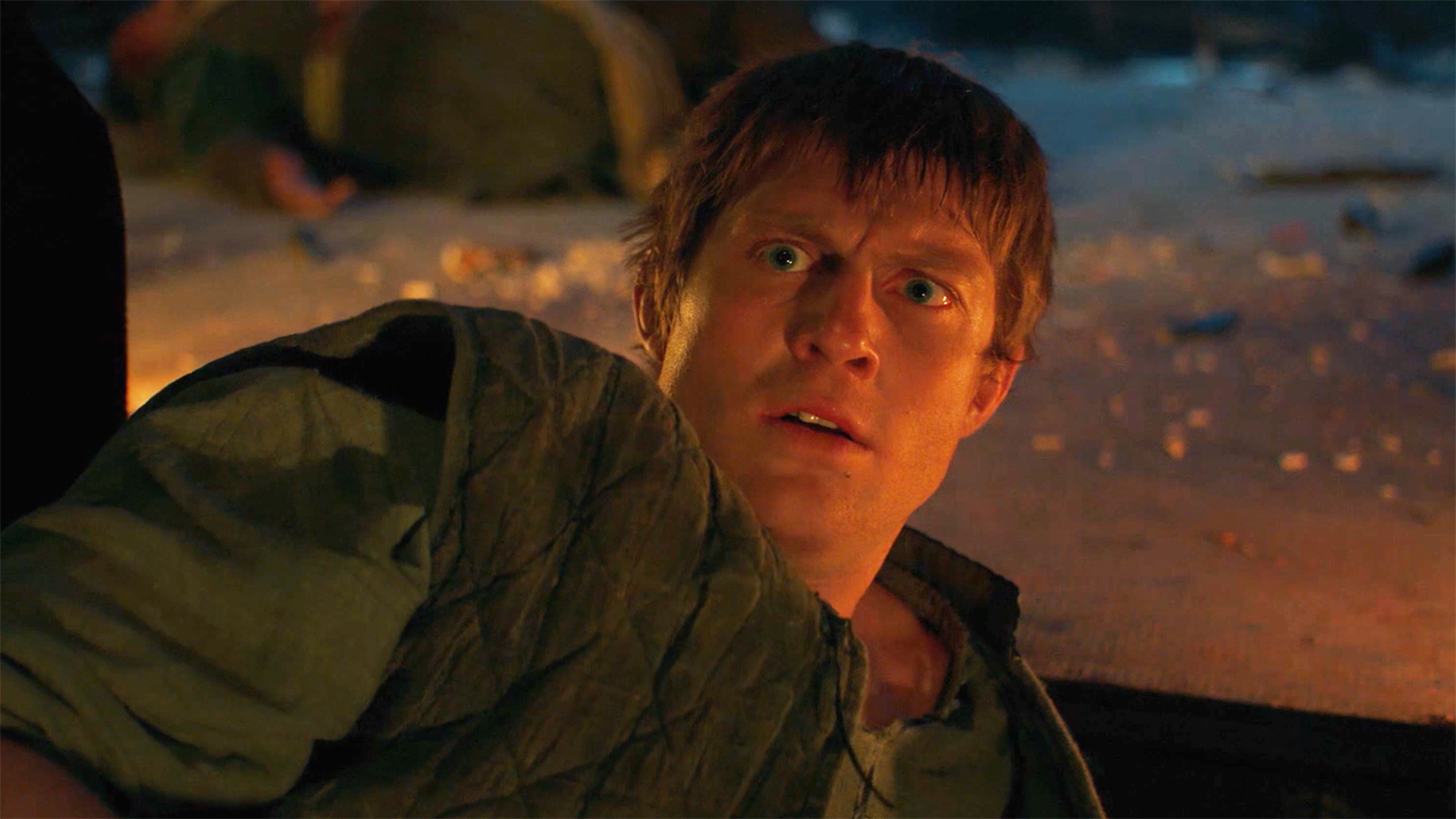 A puzzled Dunk lying on the ground and looking at an off-camera Egg in A Knight of the Seven Kingdoms episode 3