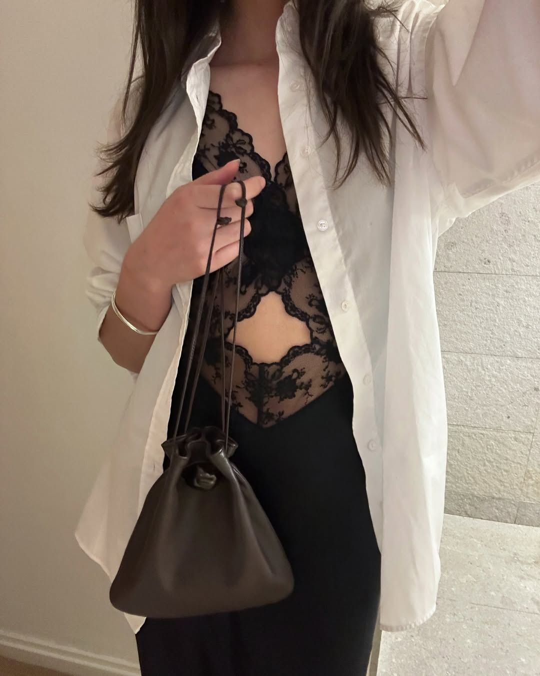 Selena Mual carrying an Ayllon pouch bag