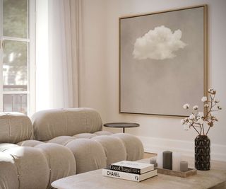cream toned living room with art featuring cloud on wall