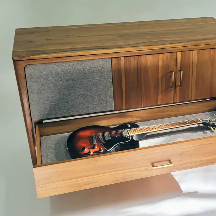 The Sonoforma Serenana guitar cabinet with its bottom drawer open, containing a Gibson Les Paul Special