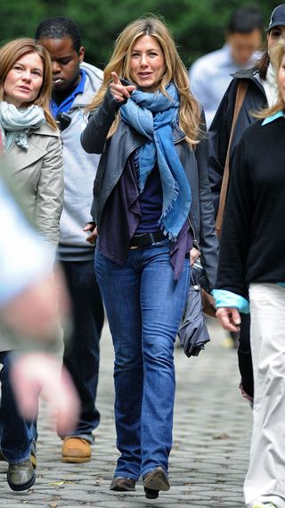 Jennifer Aniston wearing jeans and a denim scarf