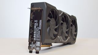 An AMD Radeon RX 7900 XTX on a table against a white backdrop