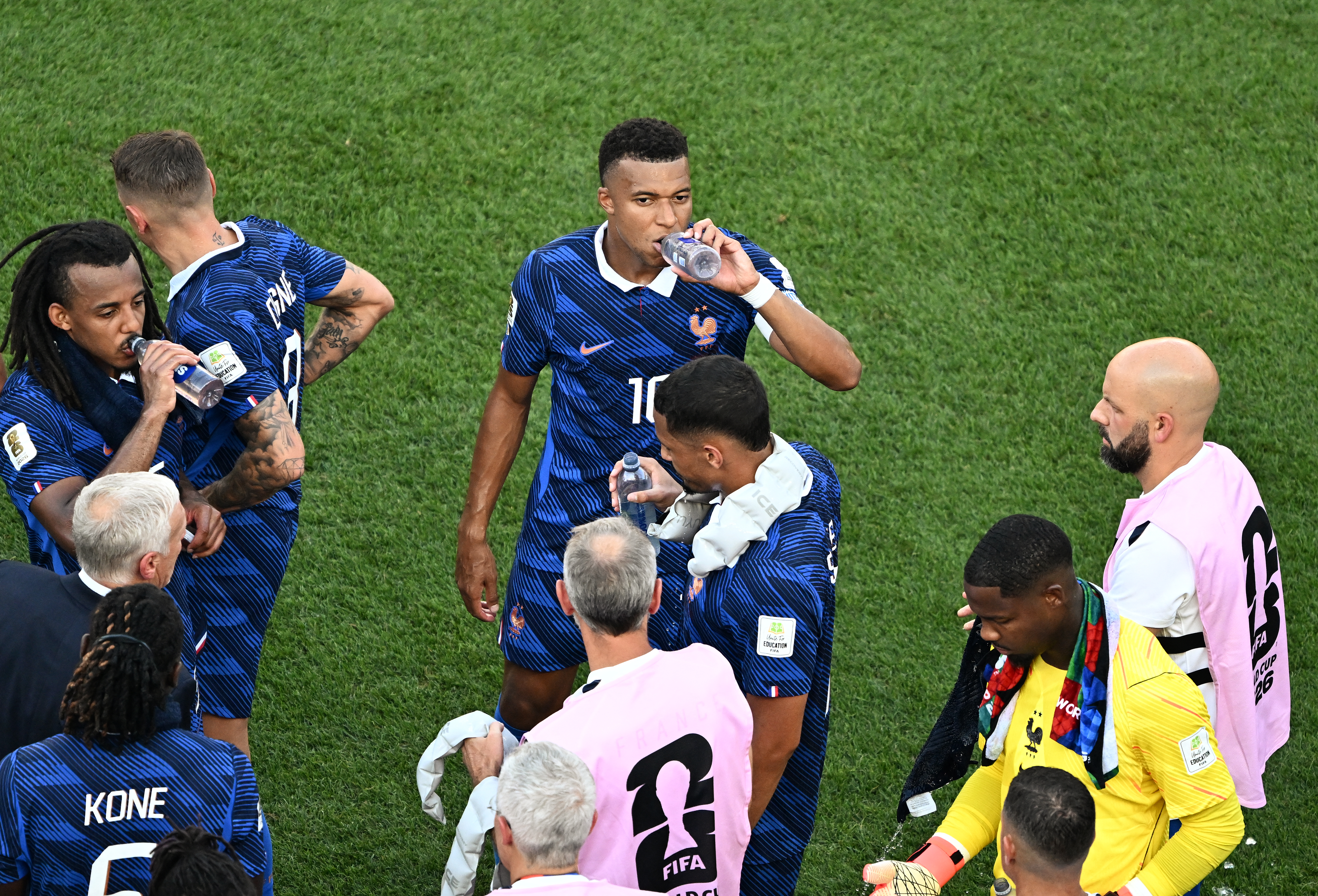 France's forward #10 Kylian Mbappe and teammates take the hydration break during the 2026 World Cup round of 16 football match between Paraguay and France at the Philadelphia Stadium in Philadelphia on July 4, 2026. (Photo by Jewel SAMAD / AFP)