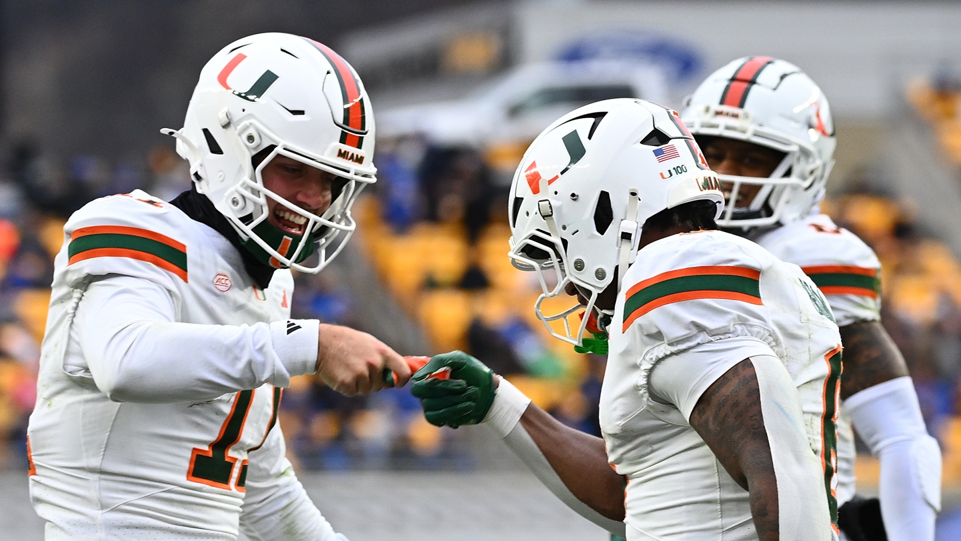 Miami Hurricanes quarterback Carson Beck celebrating with running back Charmar Brown