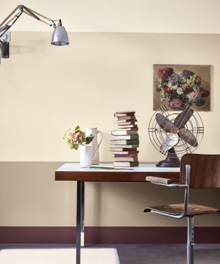 Home office with cream and beige walls and floral artwork