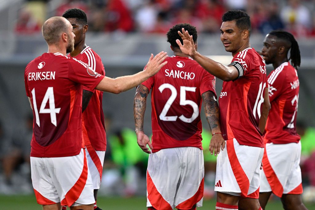 SAN DIEGO, CALIFORNIA - JULY 31: Carlos Casemiro #18 of Manchester United celebrates with Christian Eriksen #14 after scoring a goal against Real Betis during the first half at Snapdragon Stadium on July 31, 2024 in San Diego, California. (Photo by Orlando Ramirez/Getty Images)