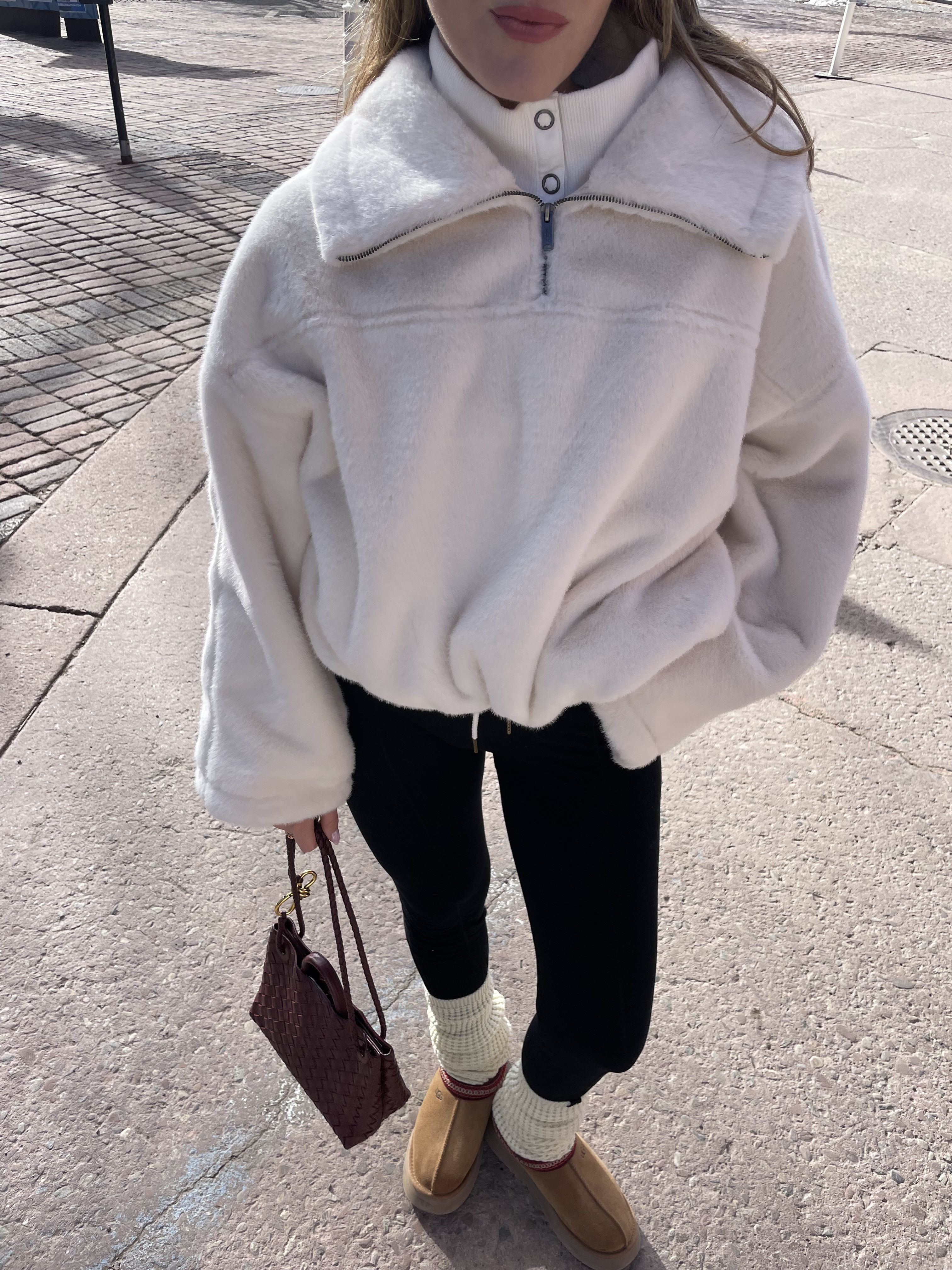 Anna LaPlaca wearing an FP Movement fleece with leggings in Aspen.