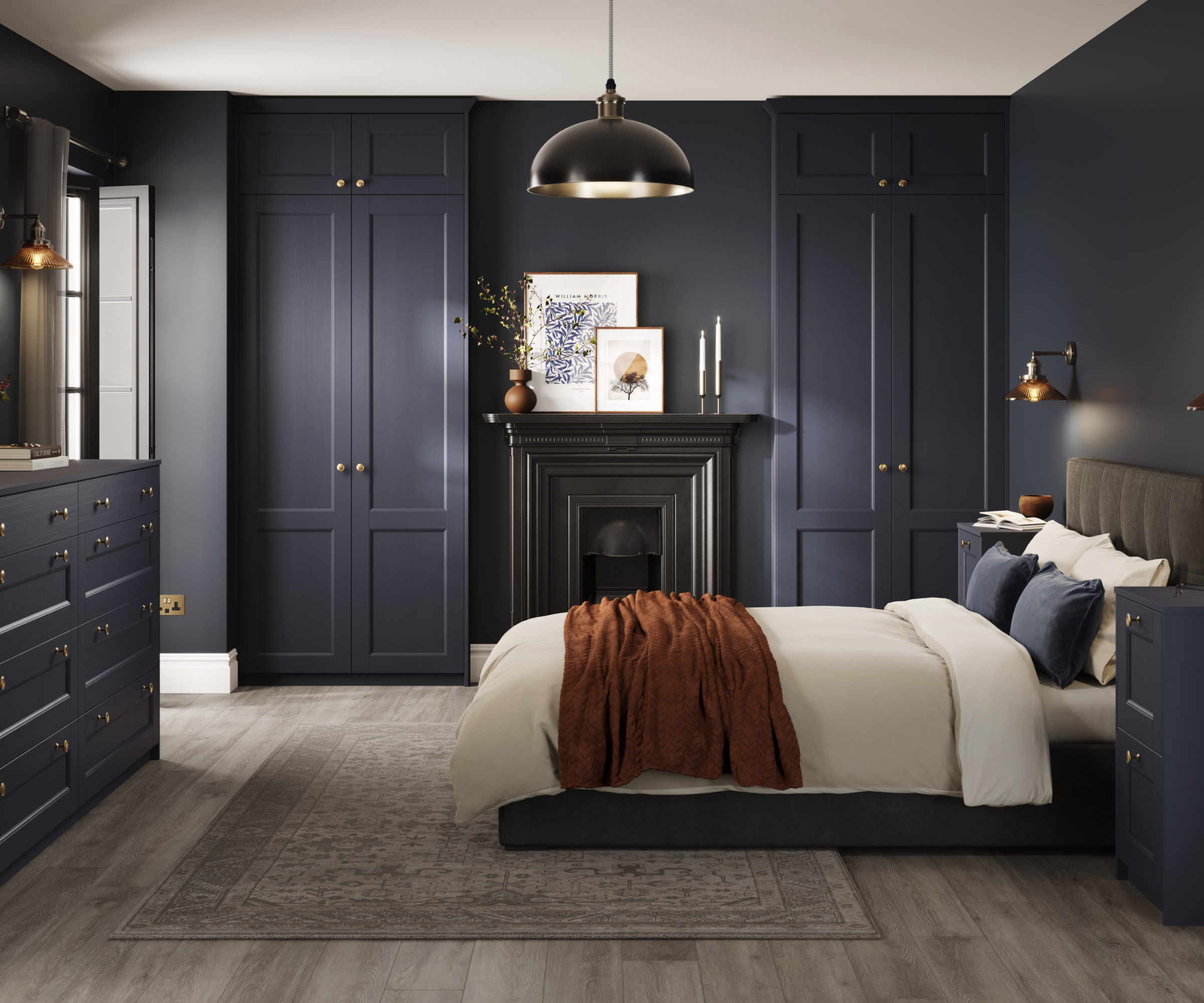 navy fitted wardrobes in bedroom with fireplace and bed