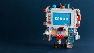  Toy robotic computer with light bulb and broken circuit on dark blue background. Text message Error on blue screen.