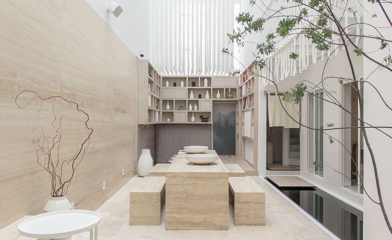 Seating area, well lit with rope design architecture hanging from ceiling