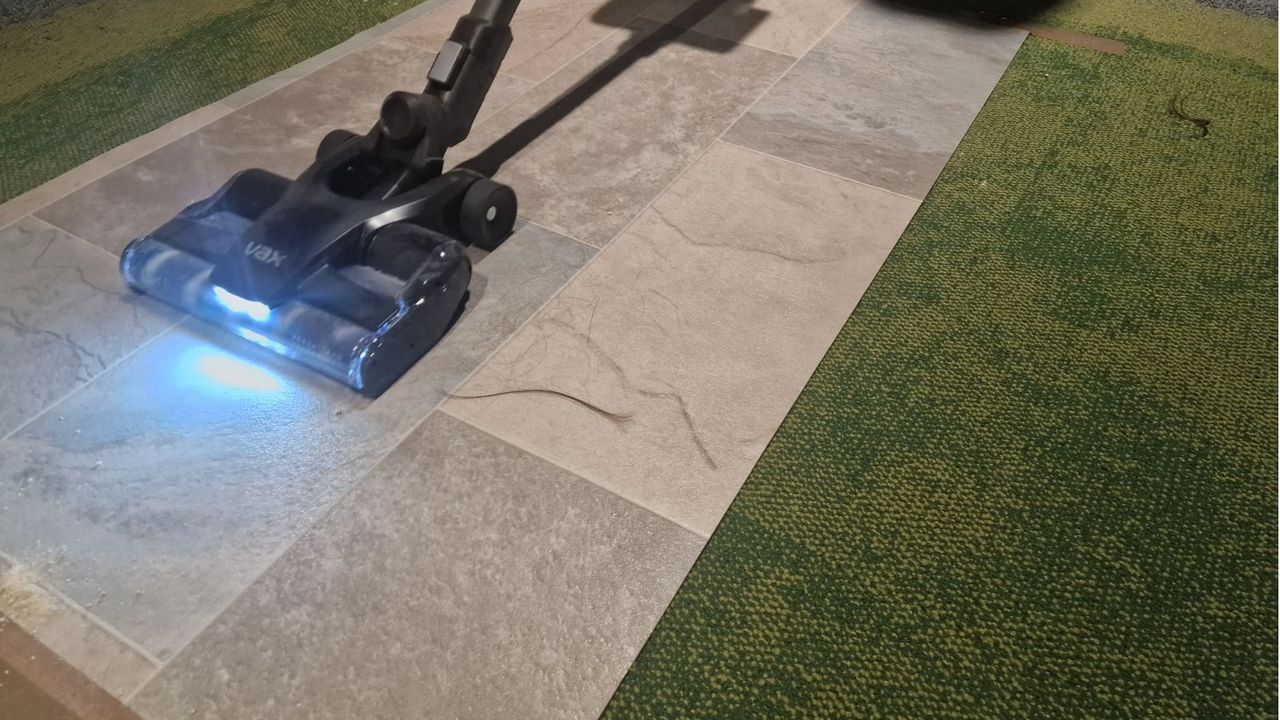 The Hoover Vaccum sucking up hair from lino