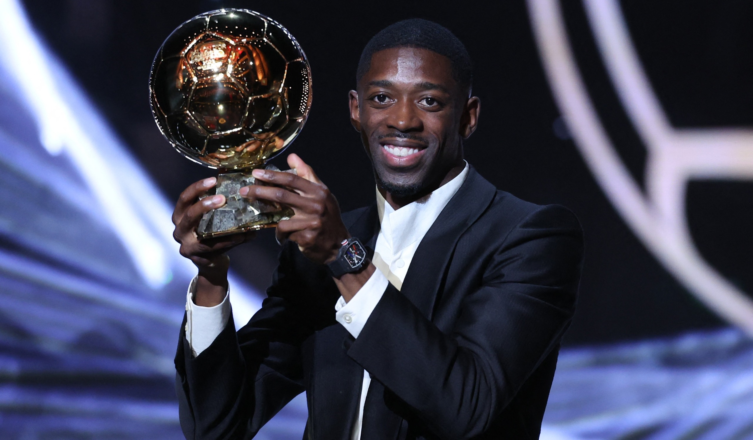 Paris Saint-Germain French forward Ousmane Dembele with the Ballon d'Or award during the 2025 Ballon d'Or France Football award ceremony at the Theatre du Chatelet in Paris on September 22, 2025