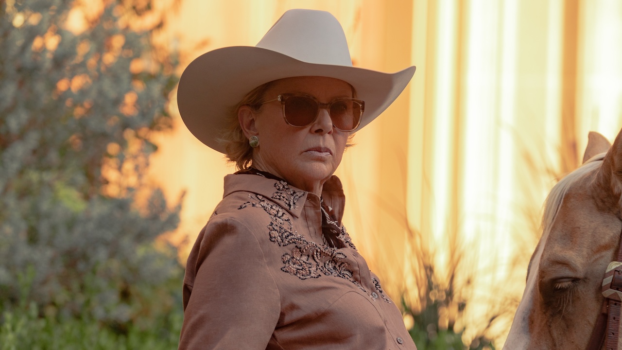 Beulah Jackson sitting near horse in Dutton Ranch