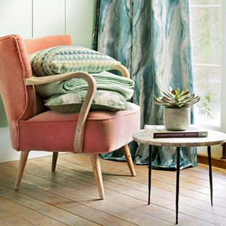 Pink armchair with blankets
