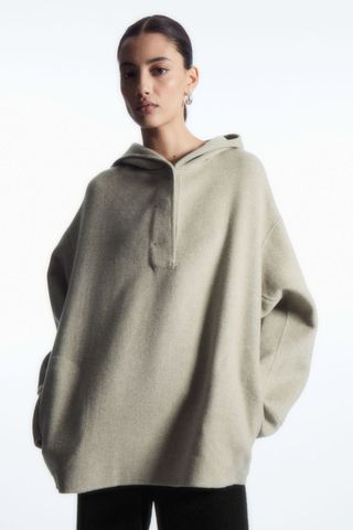 woman wearing wool hoodie from the cos sale