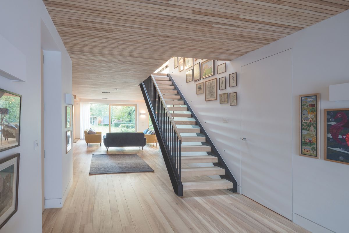 wood lined staircase in self build hallway