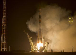 A Soyuz rocket launches toward the International Space Station from Baikonur Cosmodrome in Kazakhstan on March 27, 2015, carrying NASA astronaut Scott Kelly and Russian cosmonauts Mikhail Kornienko and Gennady Padalka. Kelly and Kornienko will stay aboard