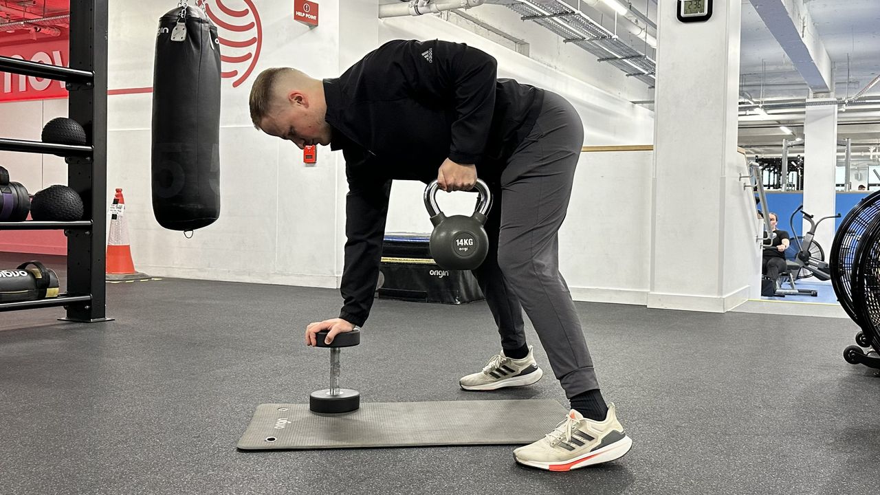 Ollie Thompson performing a kettlebell gorilla row
