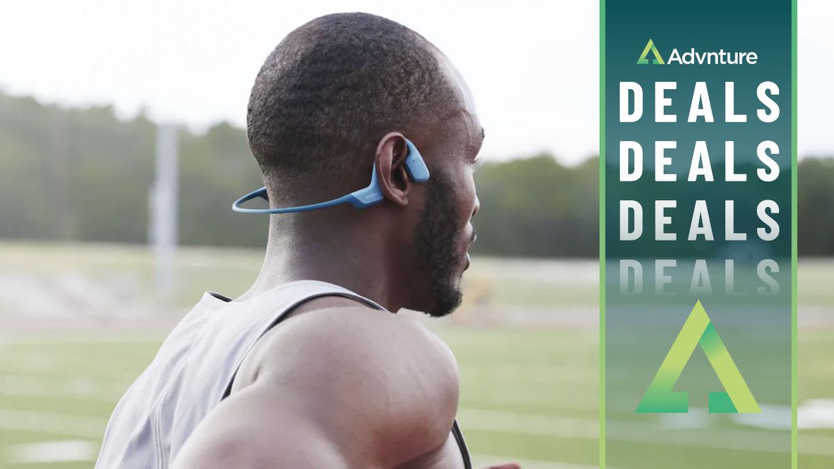 Man running wearing Shokz OpenRun Pro headphones