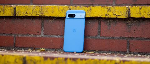 A Bay blue Google Pixel 8a on a staircase