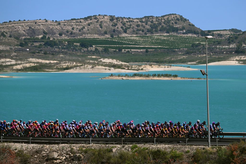 PILAR DE LA HORADADA SPAIN MAY 02 A general view of the peloton passing through Embalse de la Pedrera landscape during the 9th La Vuelta Femenina 2023 Stage 2 a 1058km stage from Orihuela to Pilar de la Horadada UCIWWT on May 02 2023 in Pilar de la Horadada Spain Photo by Dario BelingheriGetty Images