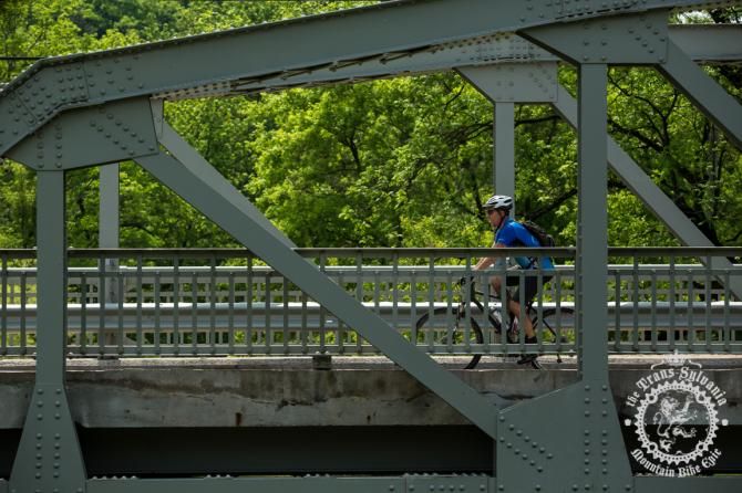 A rider enjoys the bridges of the quaint town of Coburn halfway through stage 4