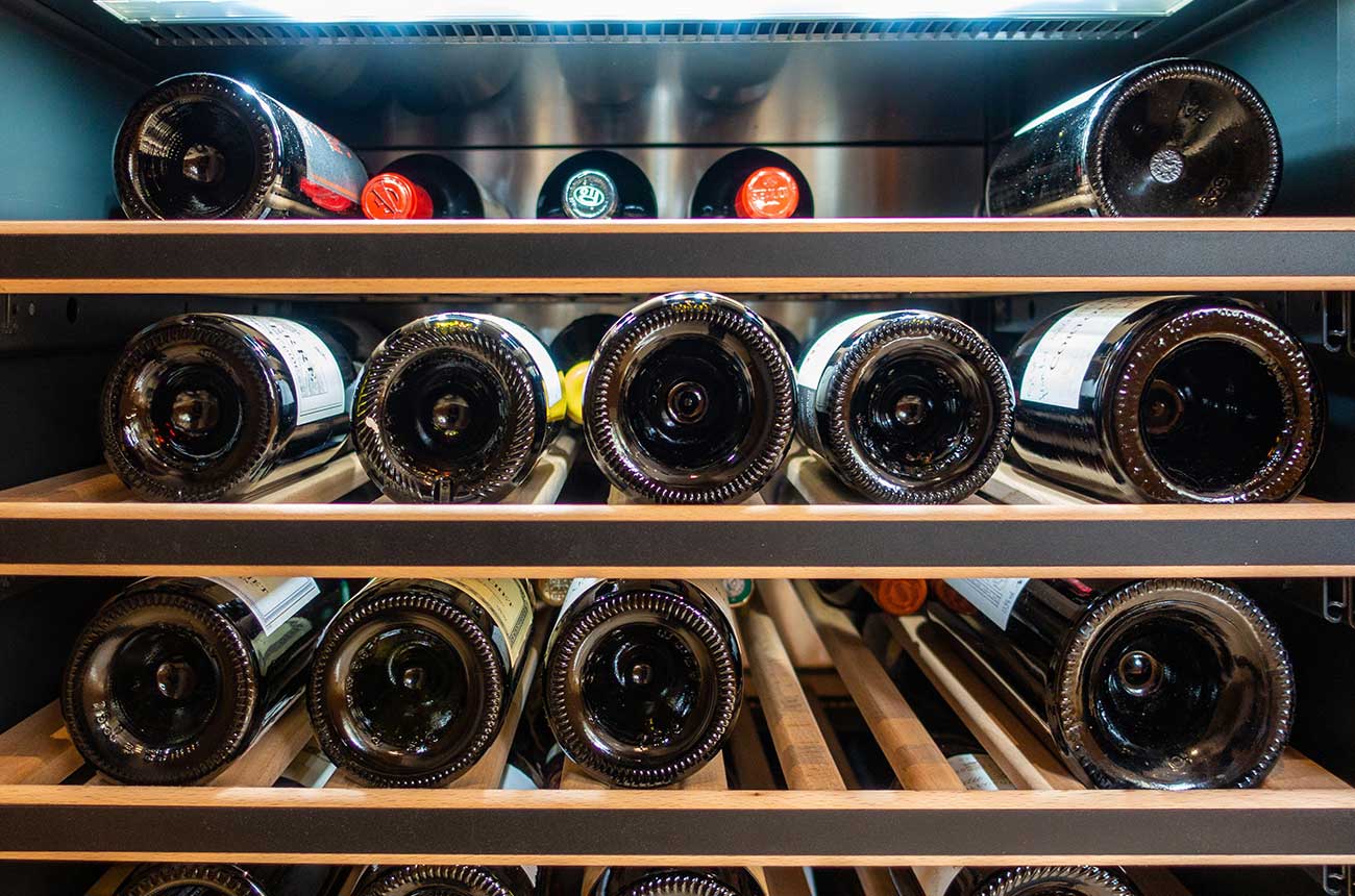 Bottles of wine in a wine fridge