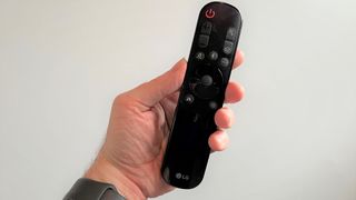 LG S80QY soundbar remote control against white background