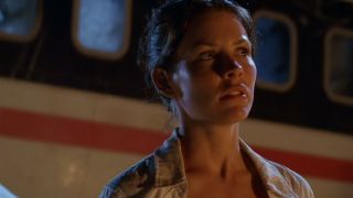 Evangeline Lilly looking nervous, standing in front of a plane in Lost