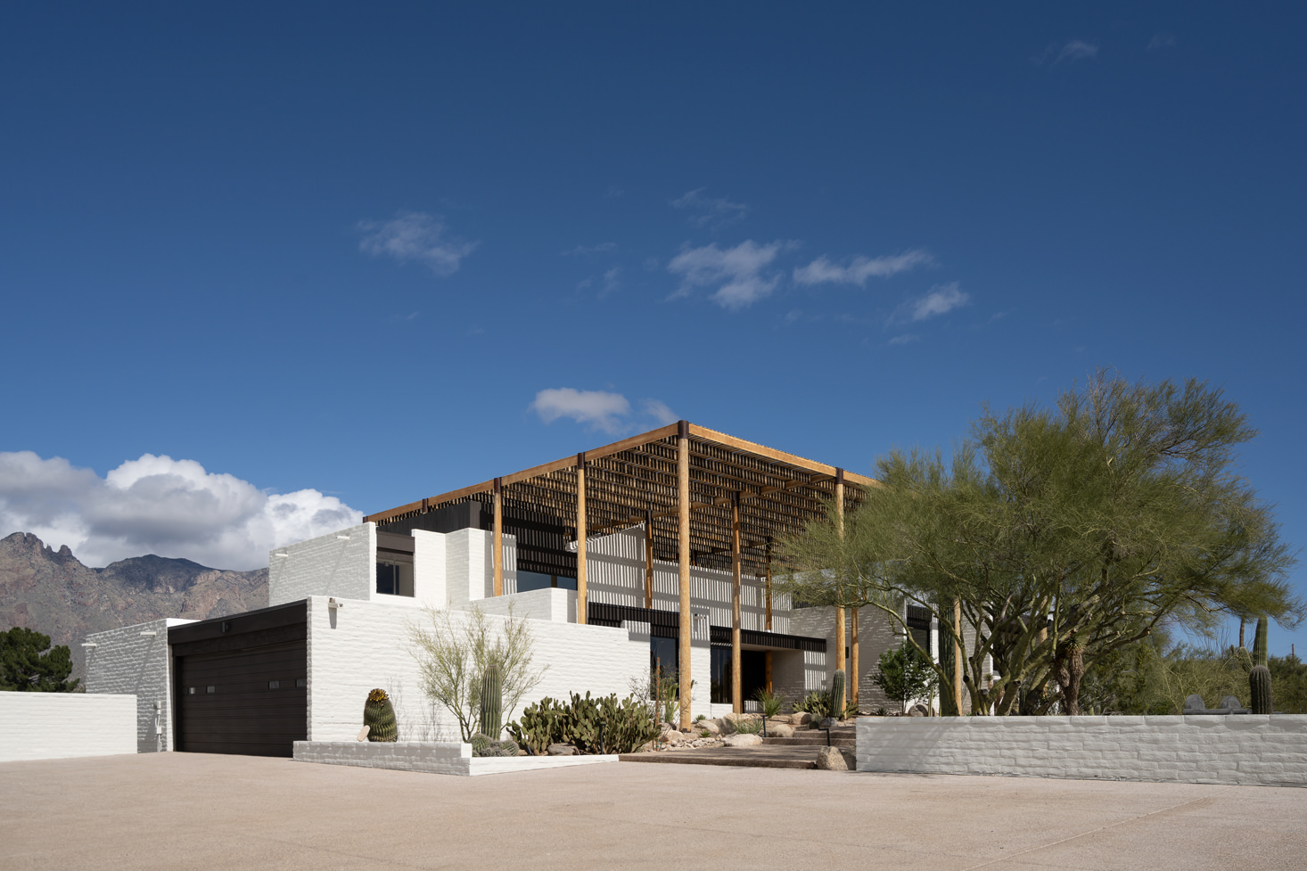 view of Ramada House by Judith Chafee, white, simple modernist house in the american desert