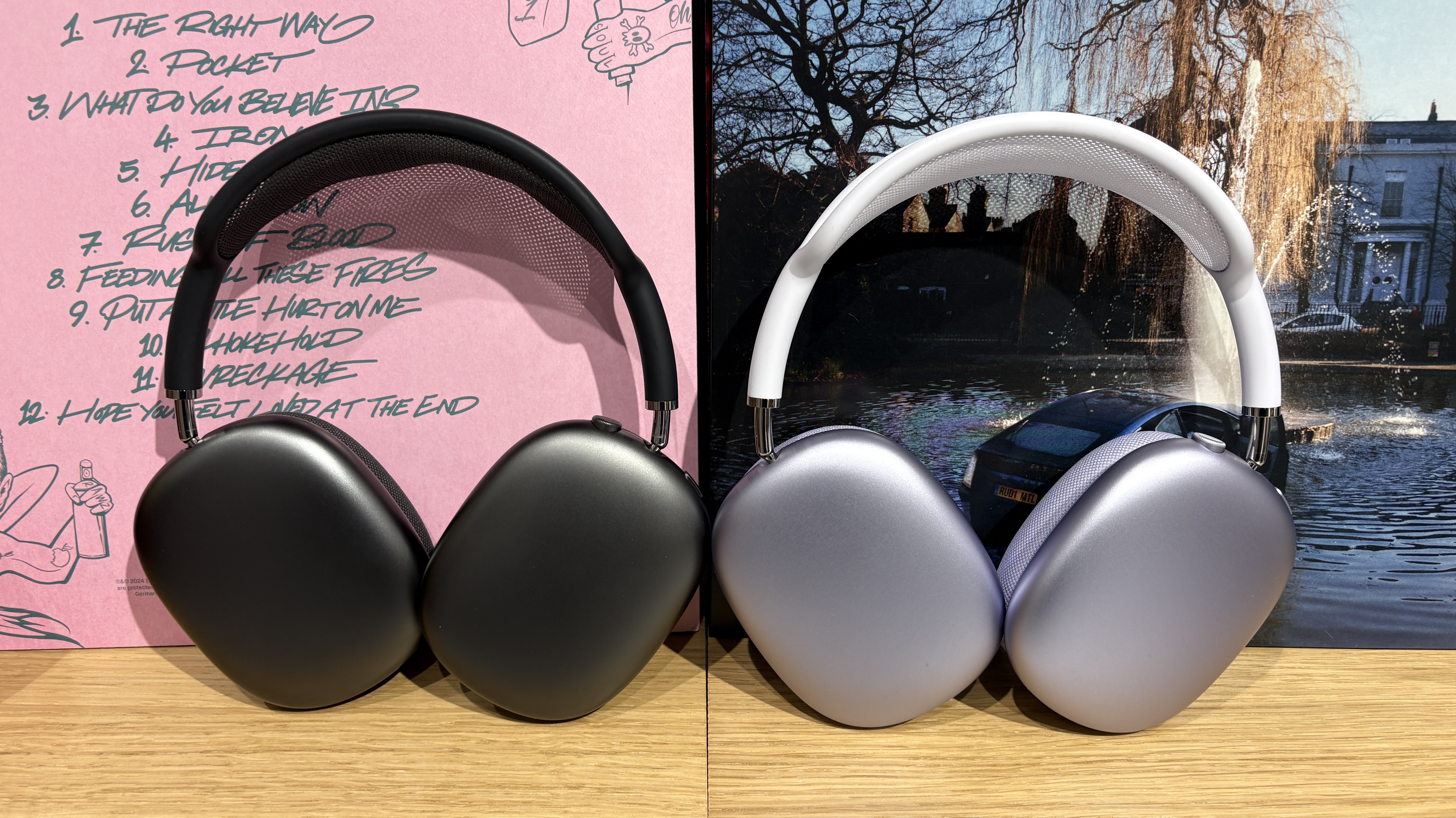 AirPods Max 2 in purple next to AirPods Max original in black