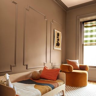 Benjamin Moore Chowning's Tan CW-195 paint used in a children's room with panelling on the wall