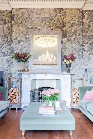 View of the sitting room fireplace and vintage wallpaper