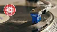 Ortofon cartridge resting on a vinyl record