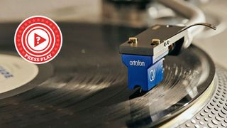 Ortofon cartridge resting on a vinyl record