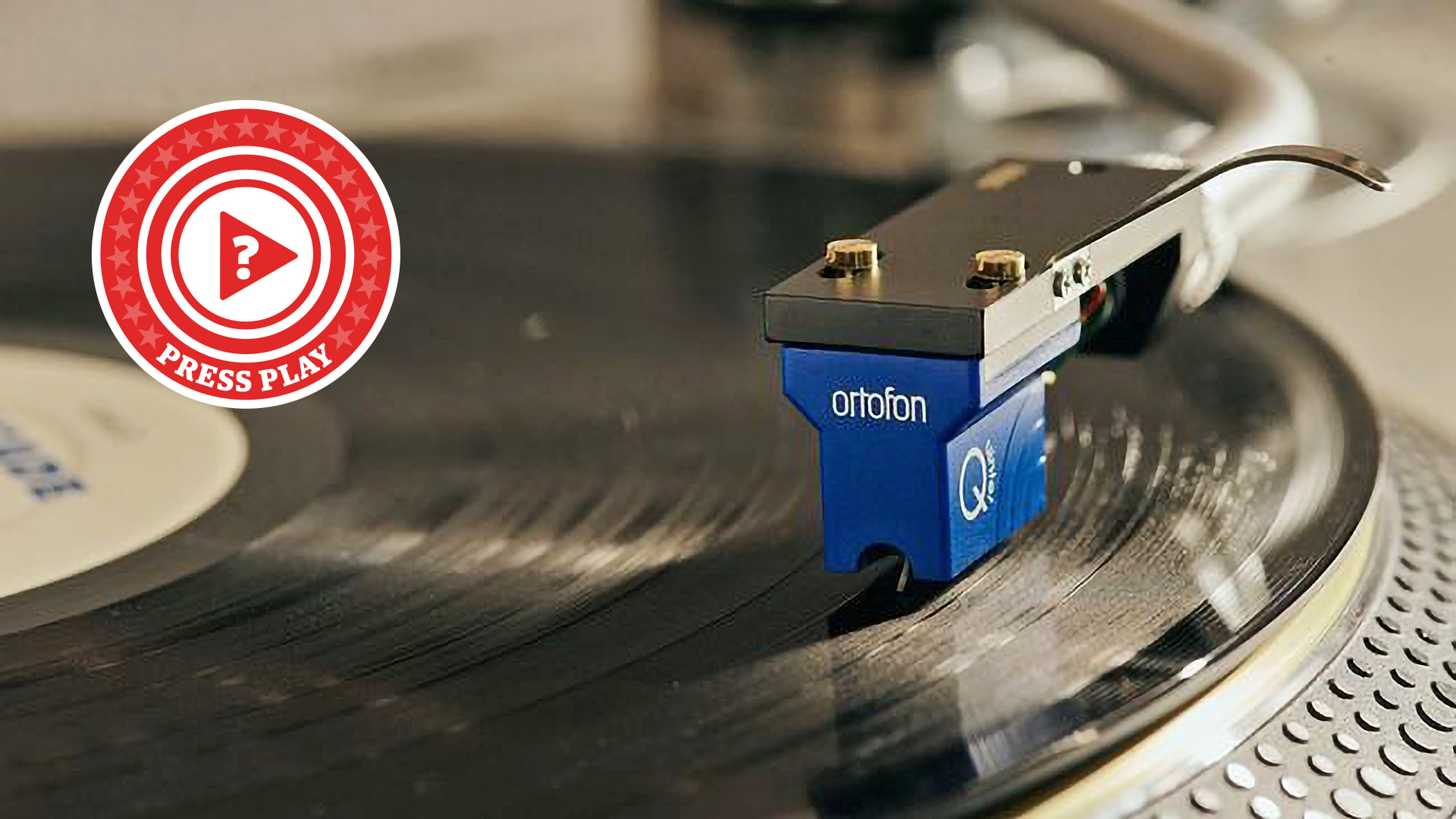 Ortofon cartridge resting on a vinyl record